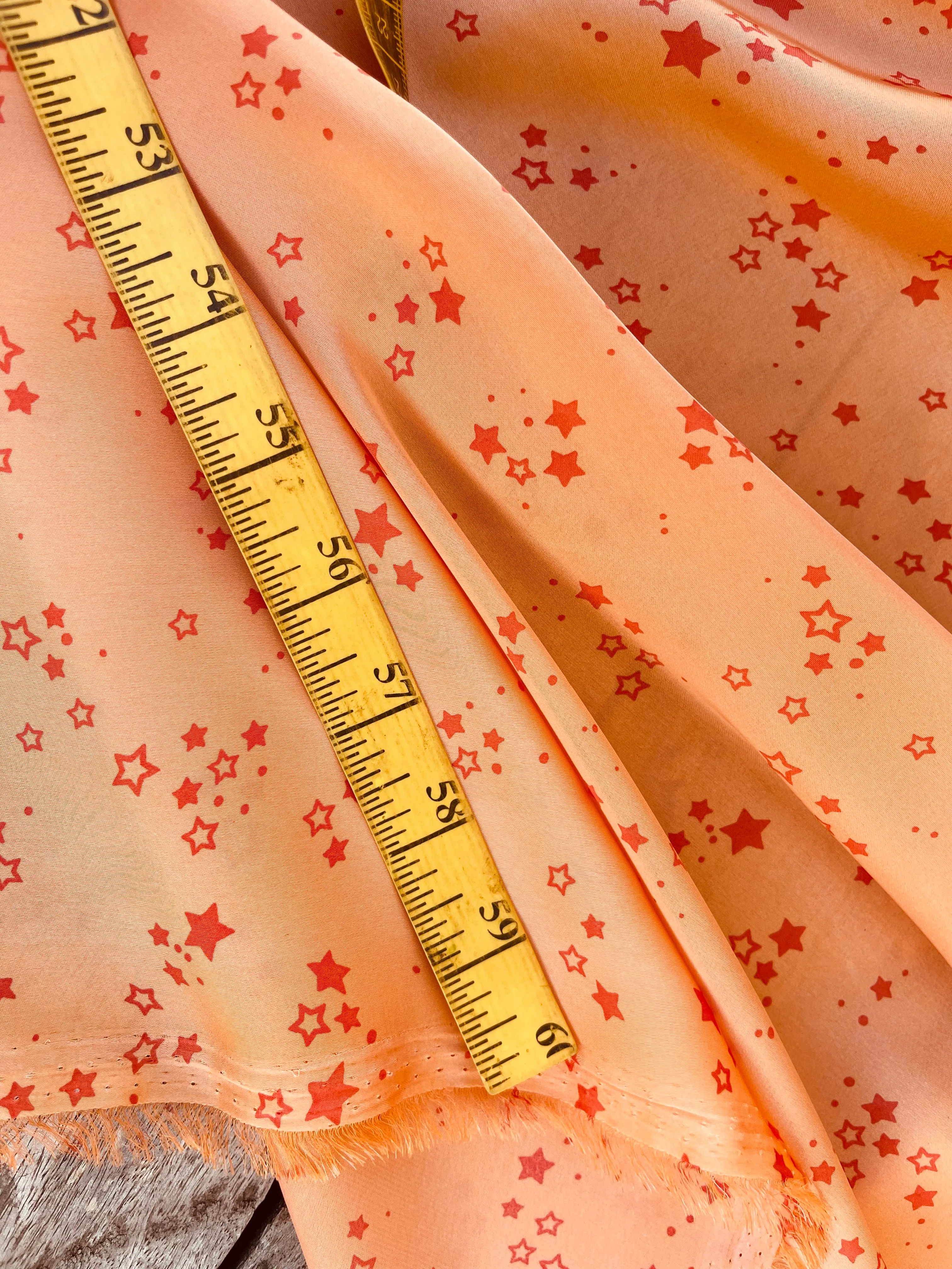 Lightweight  satin  fabric by the yard - Orange Stars  print